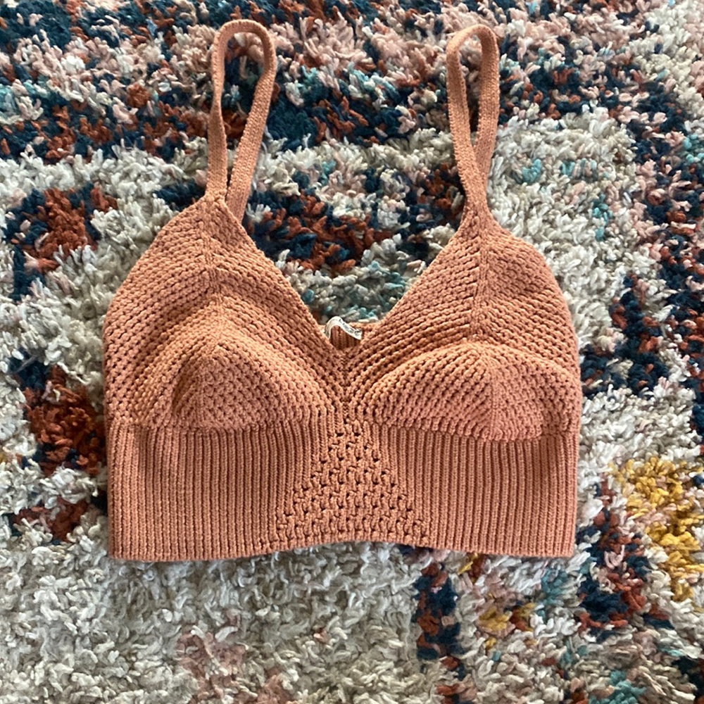 Free people tan top super stretchy can fit small and medium.
